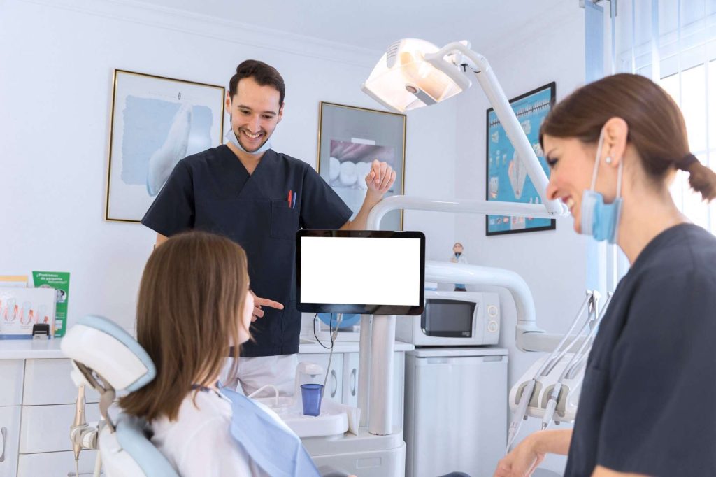 Vancouver Dentist talking with the patient