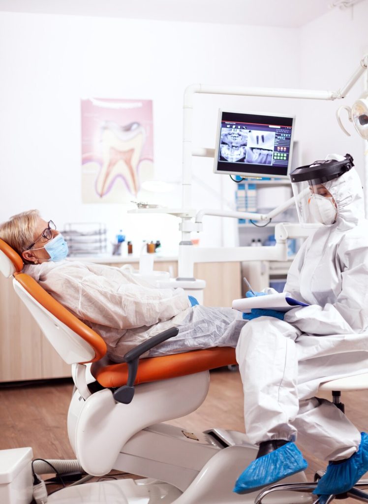 Dental patient speaking with clinic staff