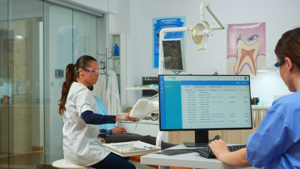 Dentist explaining treatment options to a patient
