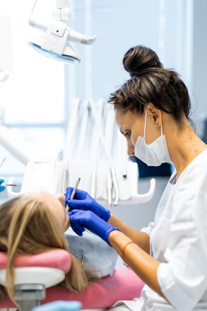 Experienced Canadian dentist with patient